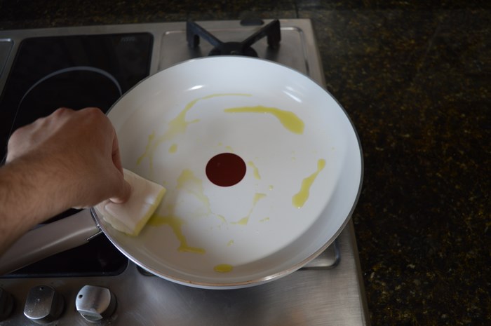 removing the extra oil from the pan